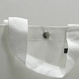 Close-up of a metal snap button on the bag opening