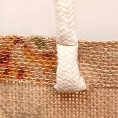 Close-up of a cotton rope handle on a jute bag, showing its texture and design as one of the customizable handle materials