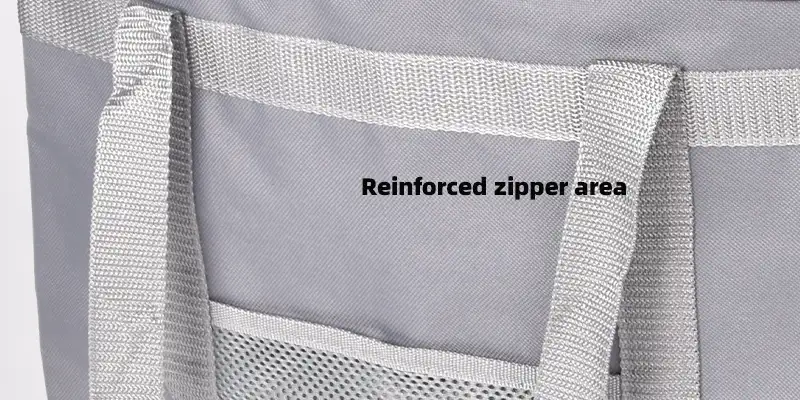Close-up of the reinforced zipper area on a cooler bag, showcasing a durable zipper design
