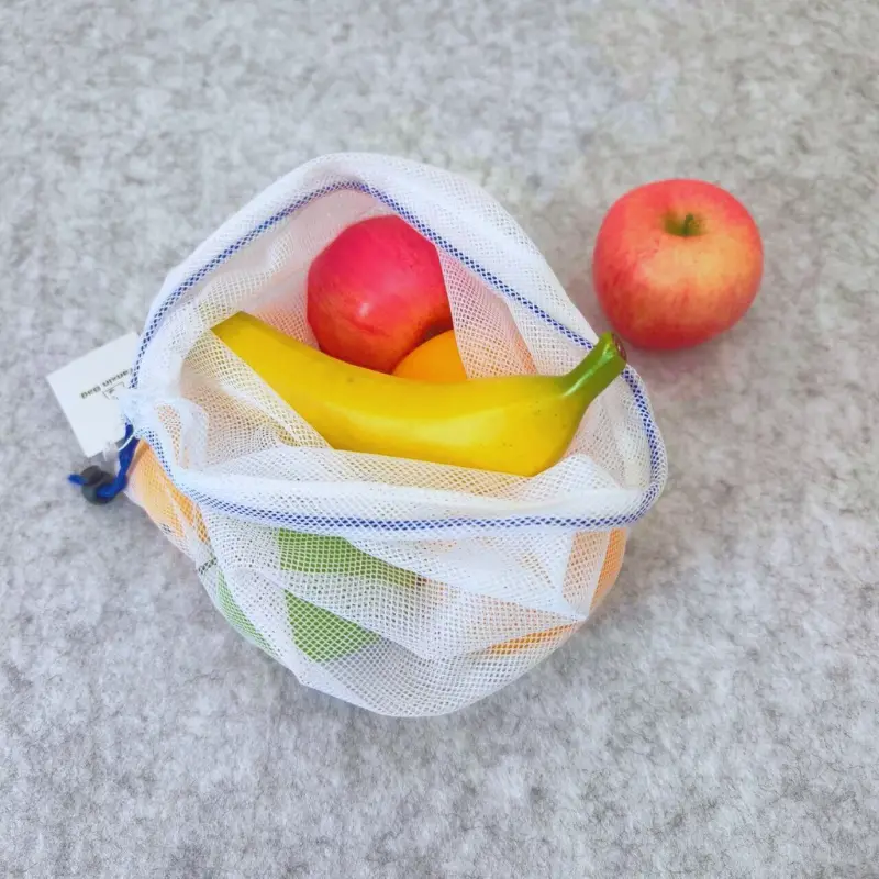 Image of a big hole polyester mesh drawstring bag, suitable for various storage needs including produce, fruits, vegetables, toys, and as product packaging.