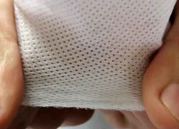 Nonwoven fabric showcasing its durability and strength for various applications