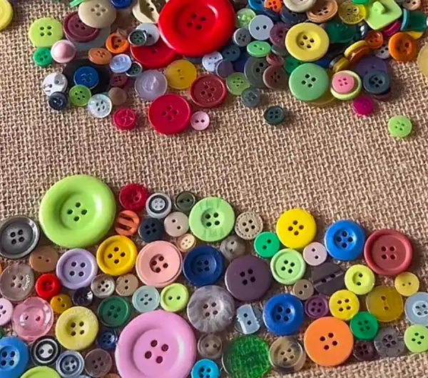 DIY jute bag decorated with colorful button embellishments