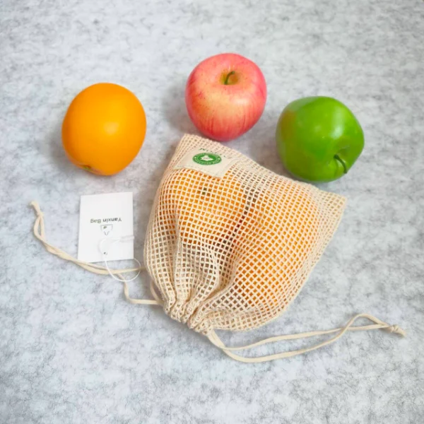 What's the Pros and Cons of Cotton Produce Mesh Bags 2 Pros and Cons of Cotton Produce Mesh Bags - A close-up of a cotton produce mesh bag showing its woven texture and flexibility.