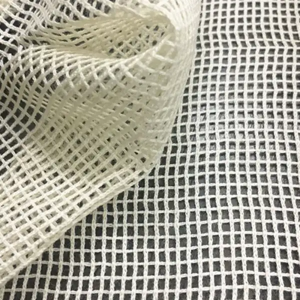 Why choose reusable produce bags, showing a close-up of mesh produce fabric for breathability and durability