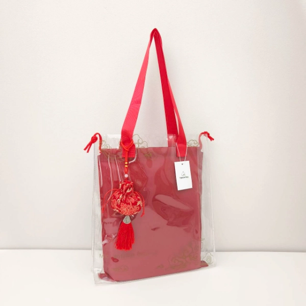 Clear PVC Tote Bag designed for durability and convenience, offering a transparent and waterproof solution.