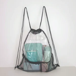 PVC clear drawstring bag with mesh pocket front view filled with items to show capacity and structure