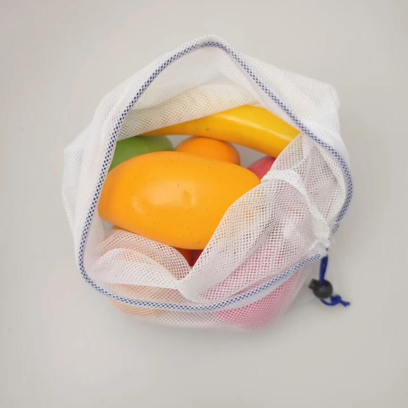 Top view of polyester mesh drawstring gym bag filled with items, showing large mesh and storage capacity