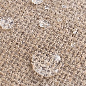 Close-up of laminated jute fabric with visible water droplets on the surface, demonstrating effective waterproofing, customizable in size, material, style, and printing.