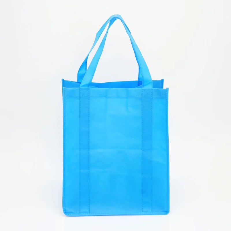 blue non woven bag with reinforced handle front view 1