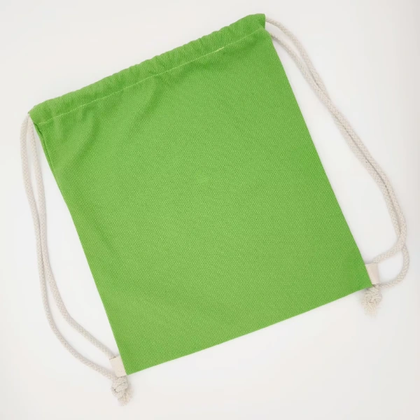 green canvas drawstring backpack natural rope flat lay