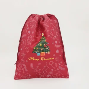 Red Christmas non-woven drawstring gift bag with printed tree and festive icons, customizable in size, material, style, and printing.