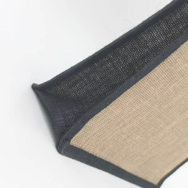 Close-up of the bottom black jute trim and side panel on a burlap tote bag, customizable in size, material, style, and printing.