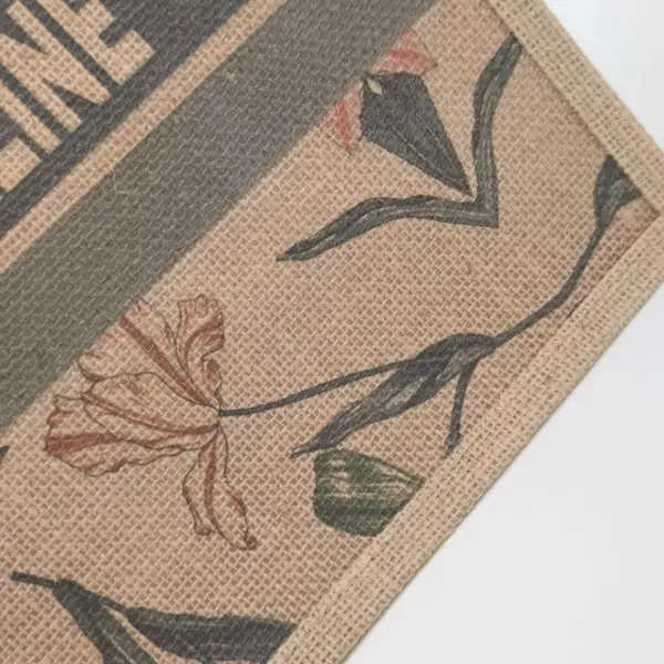 Close-up of floral illustration and printed stripe on a burlap tote bag, customizable in size, material, style, and printing.