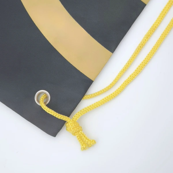 black yellow drawstring backpack detail view