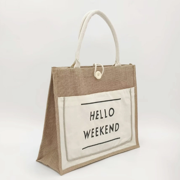Trapezoid shape jute tote bag with white rope handles and large beige front pocket featuring black printed text, shown in angled view; customizable in size, material, style, and printing.