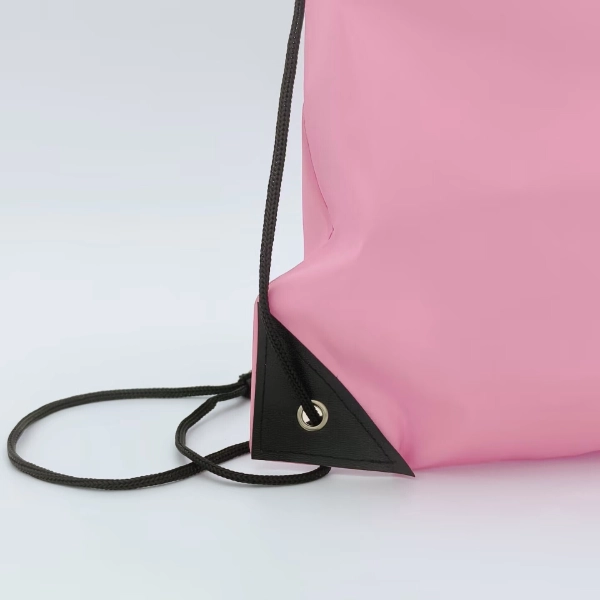 pink drawstring backpack corner detail