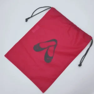 Top view of a red drawstring shoe bag with a printed black shoe graphic, simple and functional, customizable in size, material, style, and printing.
