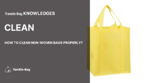 Yellow non-woven reusable shopping bag featured in an article about how to clean non-woven bags properly.