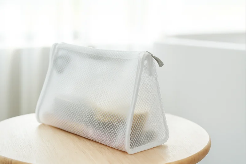mesh-textured EVA toiletry bag shown in PVC vs EVA Bags: What’s the Difference
