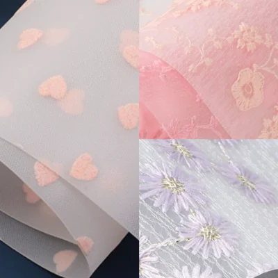 Embroidered mesh fabric laminated with EVA for soft and elegant packaging