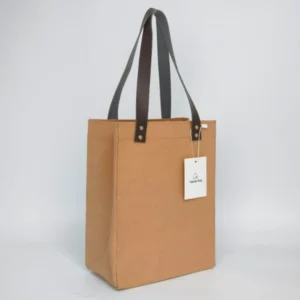 side view of washable kraft paper bag with tall profile and dark PU straps