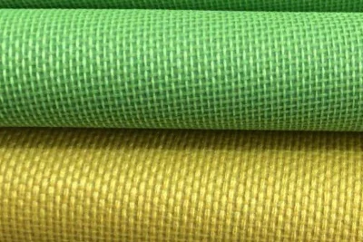 oxford fabric rolls in green and yellow showing durable woven texture used for bags and backpacks