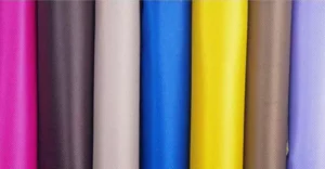 Everything You Need to Know about PVC Fabric featuring colorful Oxford fabric coated with PVC, showing smooth waterproof surfaces and textile texture.