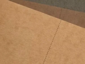 A close-up view of prewashed washable kraft paper showing a softened, natural surface texture.