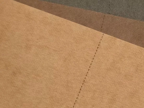 A close-up view of prewashed washable kraft paper showing a softened, natural surface texture.