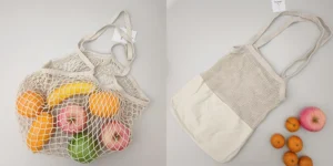 Two mesh fabric reusable bags are shown, one filled with assorted fruit and one laid flat to display its breathable structure for reusable bags.