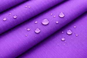 A close-up view of nylon fabric texture commonly used for bags, showing its smooth and durable surface