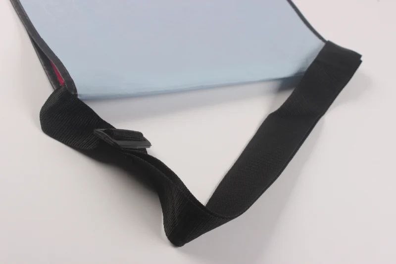 Close-up view of the adjustable shoulder strap attached to a light gray RPET laminated shoulder bag.