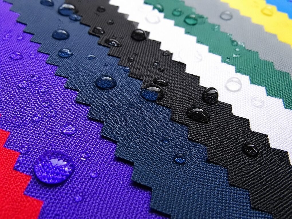 Close-up of waterproof Oxford fabric samples in various colors for bags, illustrating What Is Oxford Fabric for Bags? Complete Guide to Durability, Material Selection, and Sourcing.