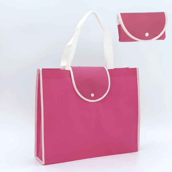 How to Choose the Right Foldable Bag for Your Business? A pink foldable tote bag is displayed in an expanded form with handles and a matching storage pouch.