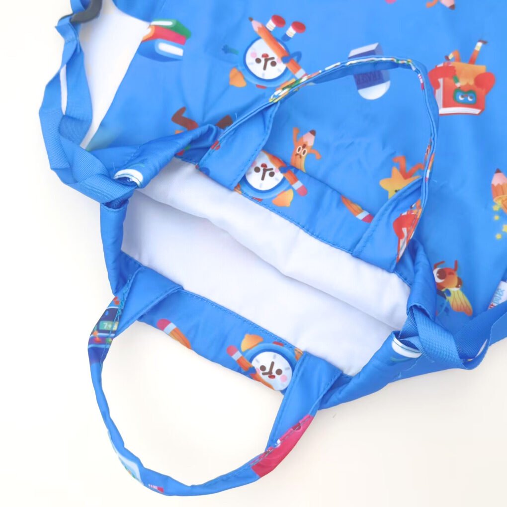 How to Choose the Right Foldable Bag for Your Business? A close-up view of a blue printed foldable bag showing the interior structure, seams, and fabric details.