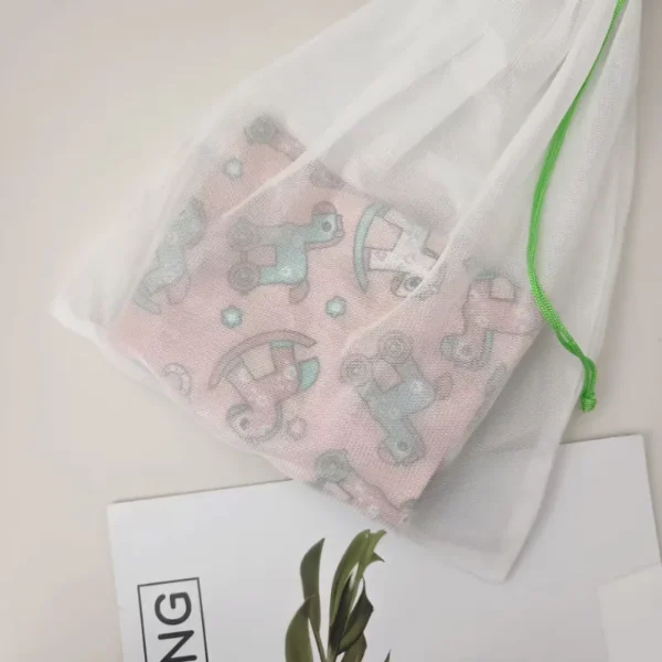 Close-up of small mesh drawstring laundry bag filled with clothing or underwear