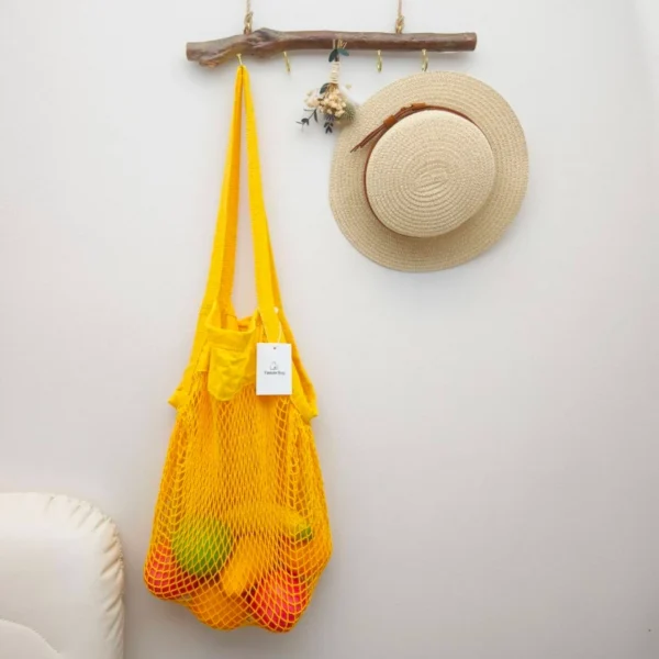 Front view of mesh market reusable grocery tote bag with wide opening and breathable design