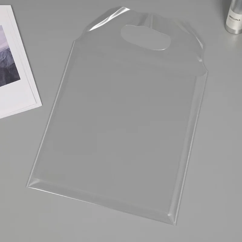 PVC vs TPU vs EVA Bags A Complete Material Comparison Guide – a clear TPU shopping bag sample PVC vs TPU vs EVA Bags A Complete Material Comparison Guide transparent TPU bag with die-cut handle