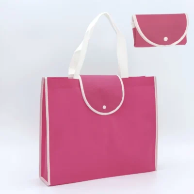 Upright view of a dark pink foldable bag with white handles and edging, foldable version shown in corner, customizable in size, material, style, and printing.